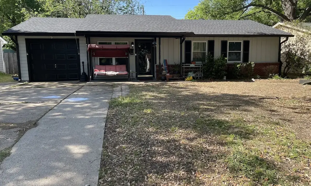 Wind Damage Roof Repair crew at work on a residential roof in Austin